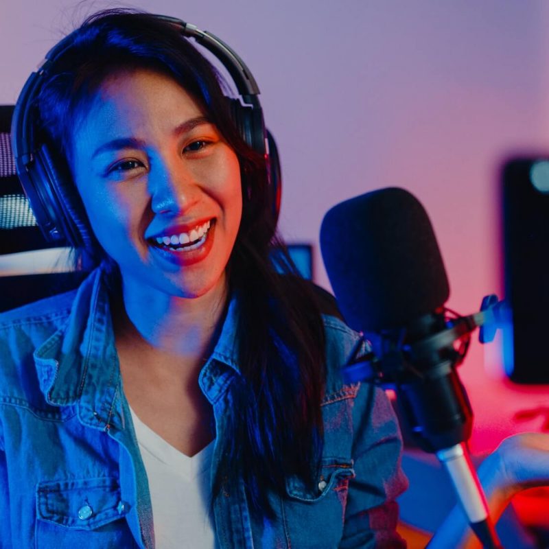 asia-girl-blogger-music-influencer-use-smartphone-broadcast-recording-wear-headphone-online-