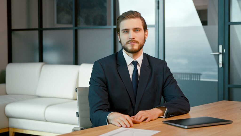 Young man looking at camera consult client