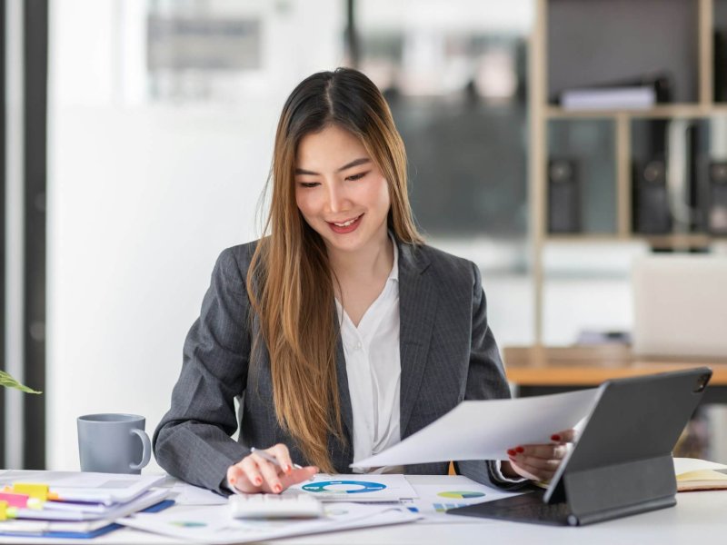 Businesswoman or accountant working Financial investment on calculator, calculate, analyze business