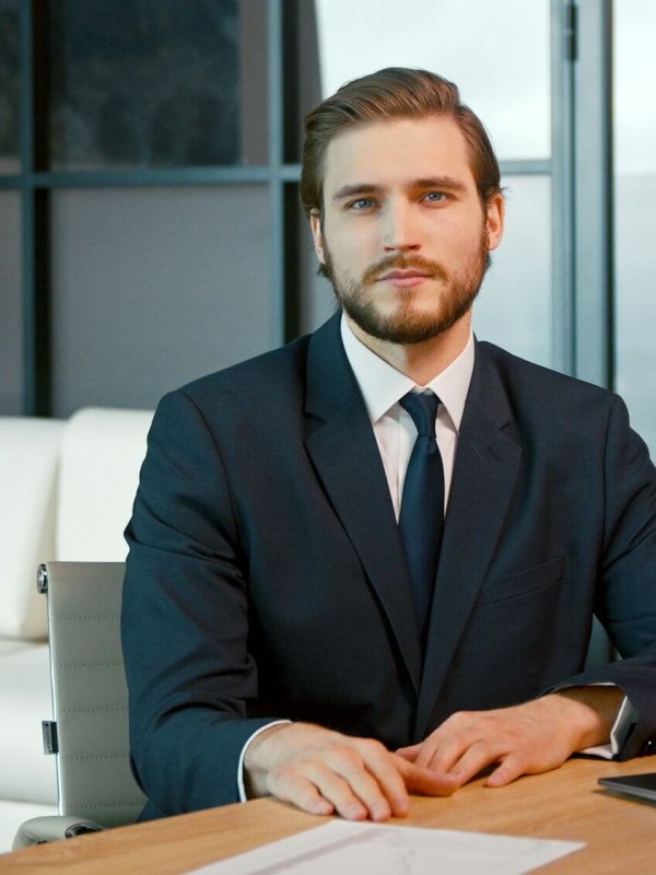 Young man looking at camera consult client