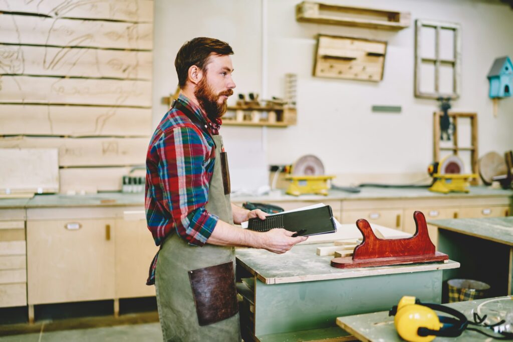 Confident worker preparing for making furniture