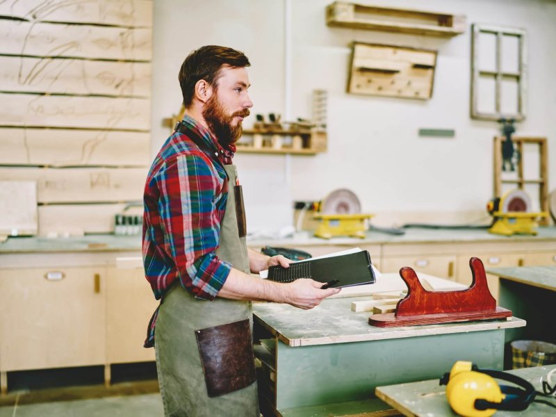 Confident worker preparing for making furniture