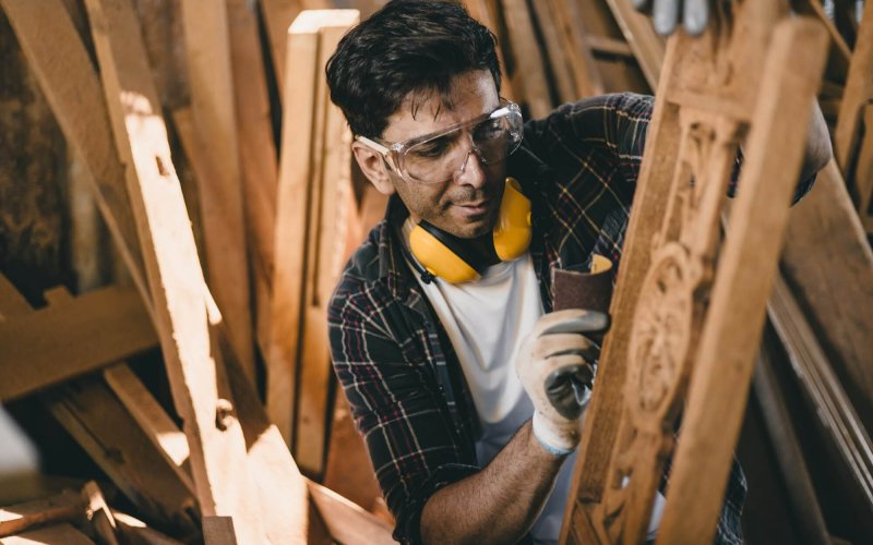 portrait professional carpenter man hand working make wooden handcraft furniture master workpiece