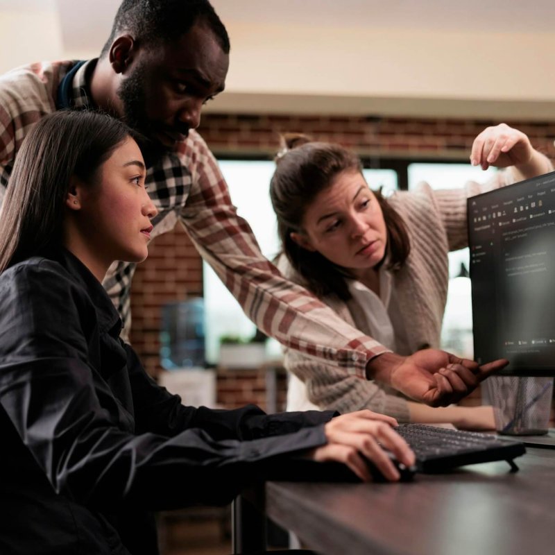 Cyber security agency multiethnic team encrypting mainframe database